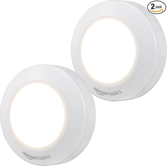 Amazon Basics LED Puck Lights, Battery Operated, 50 Lumens 2 Pack, Tap Light, Stick on Lights, Under Cabinet Lighting, Ideal for Kitchen Cabinets, Closets, Garage and More, White